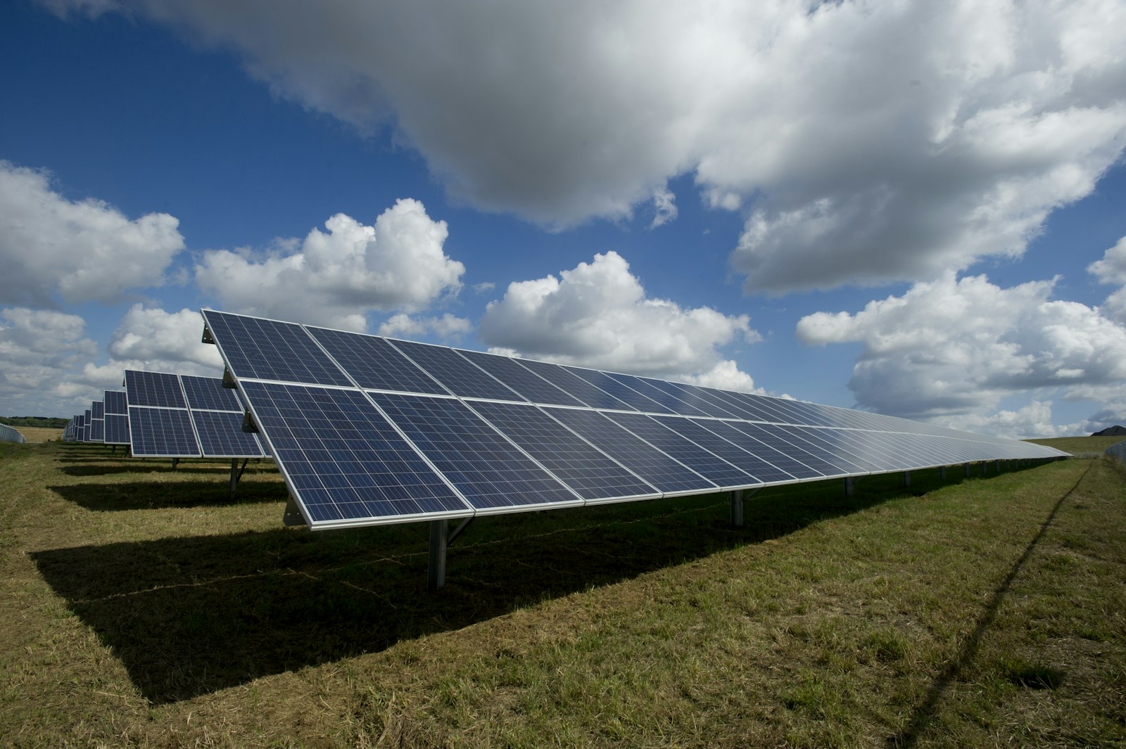 Rows of solar panels at a ground-mounted solar farm